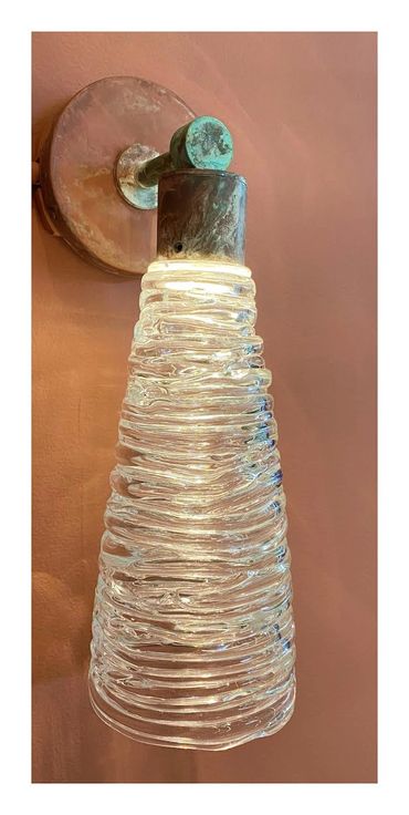 Hand-coiled clear glass set in solid brass hardware, custom hand patina finish.