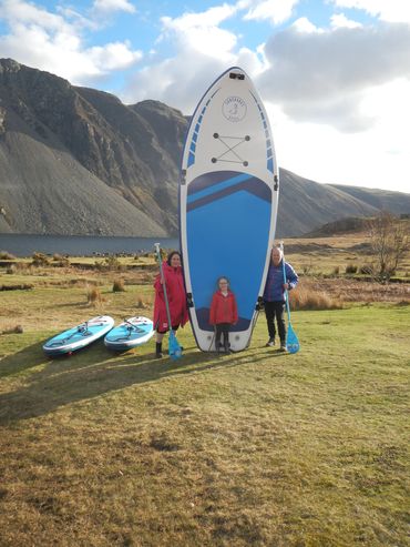 Family paddle board by Explore the Lakes