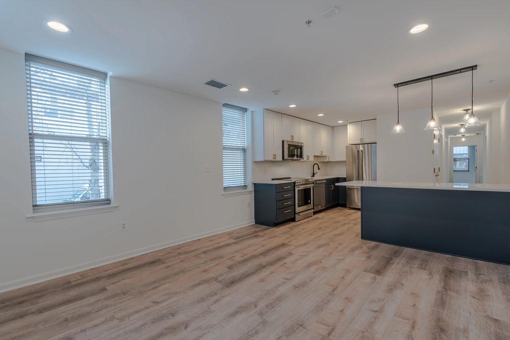 open floor plan living space and kitchen