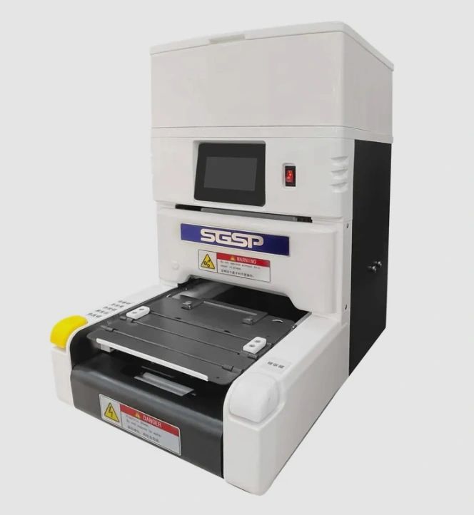 Compact laboratory or industrial machine with touchscreen and safety warnings.