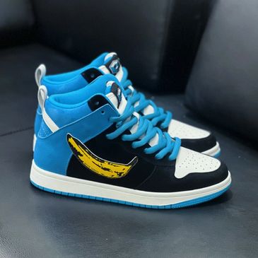 Blue and black sneakers with a yellow banana graphic on the side.
