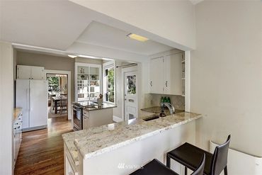 We removed a clunky, unsightly island and installed a functional space with storage and an induction