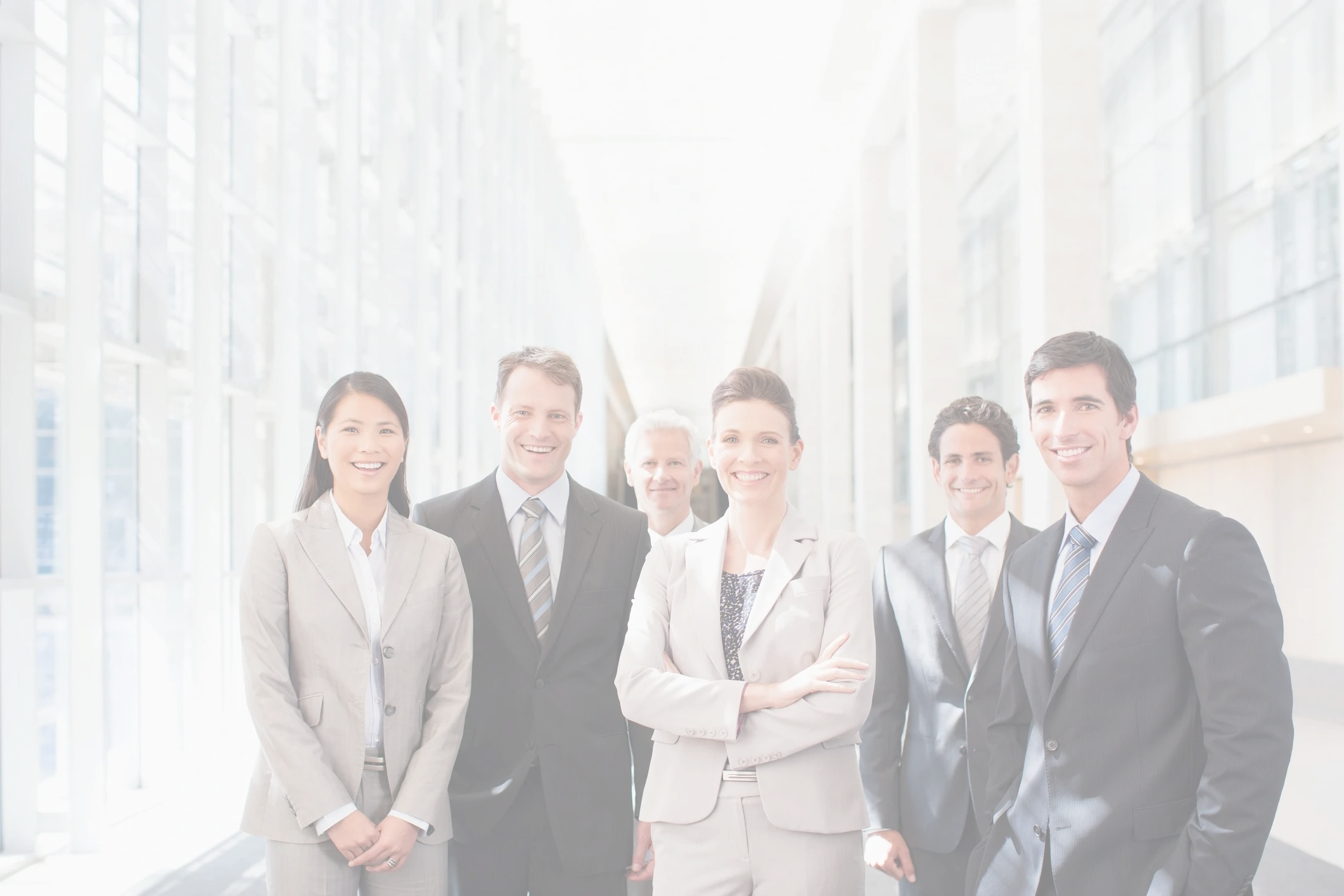 Stack of books next to pencils in a holder and a camera.