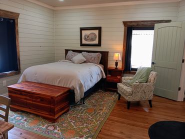 Bedroom 2 features a queen size bed with outlets with USB connections. This room offers a pretty vie