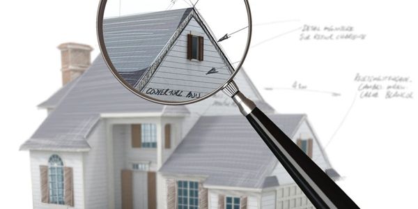 Looking at a house through a magnifying glass