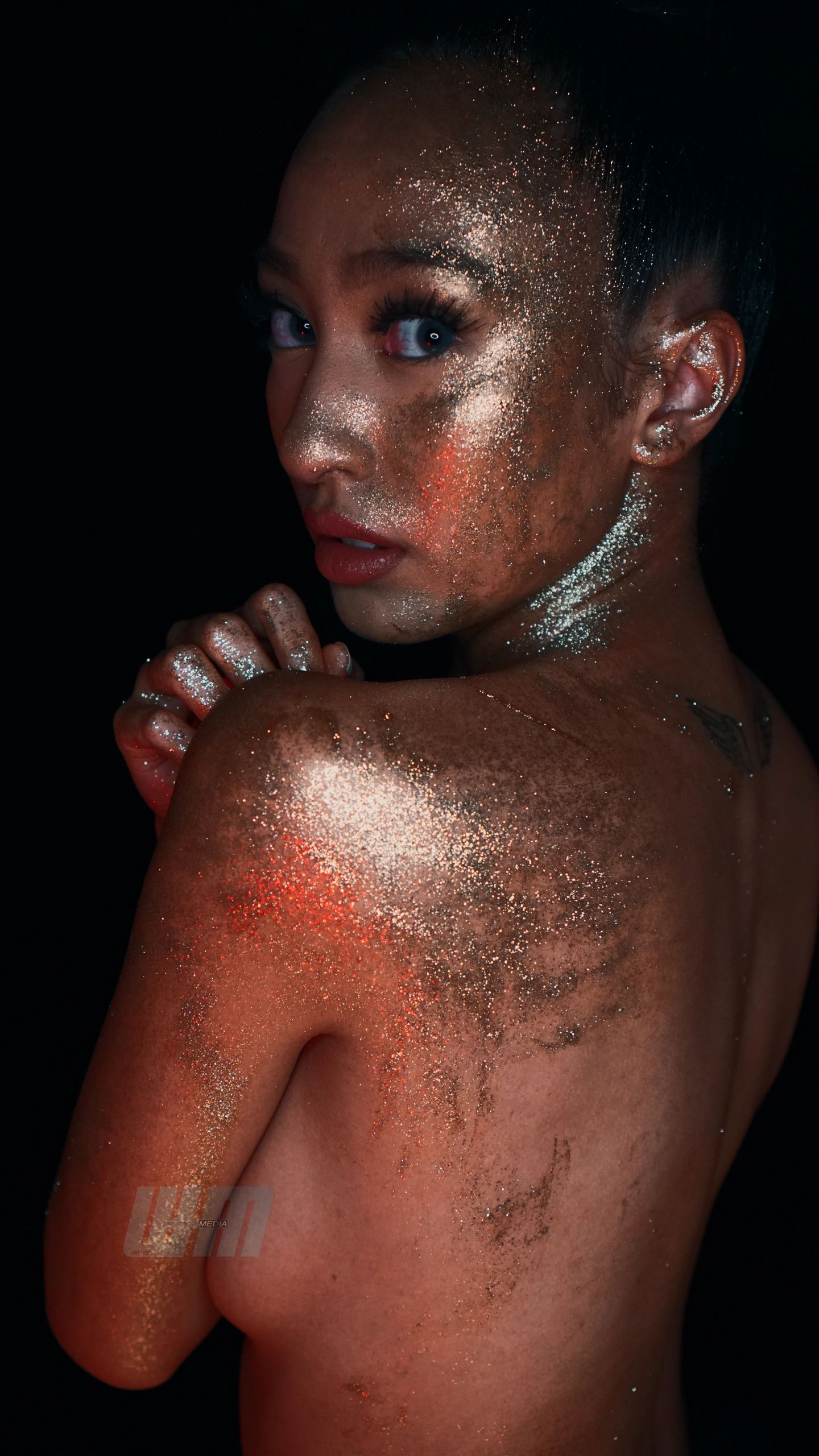 Photography, Implied model covered in glitter.