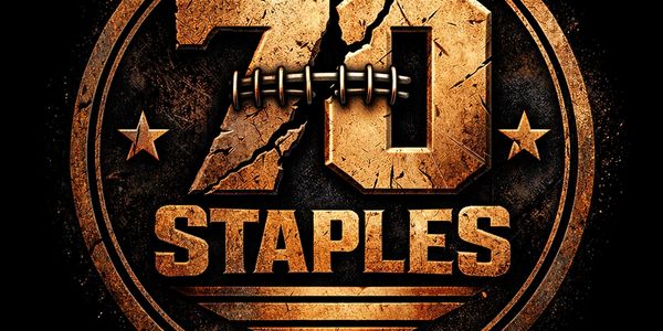 Rustic gold emblem with '70 Staples' and stars on a dark textured background.