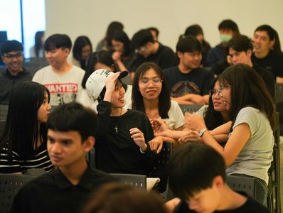 Group of young people chatting in a casual setting.