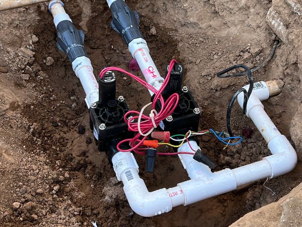 Two new valves and lines. One for the front yard, one for the backyard.