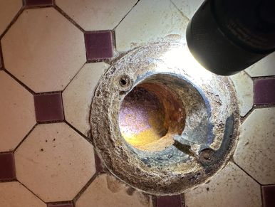 Empty Floor Drain, no water in it found during a home watch inspection.