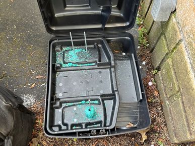 Rodent bait station next to a house was found empty during a home watch inspection.