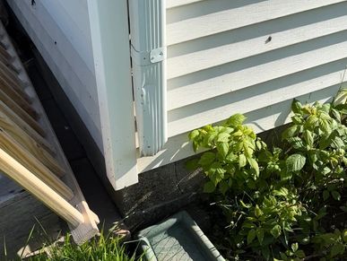 Gutter downspout missing the downspout extension found during a home watch inspection.
