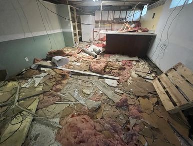 Basement ceiling ripped out by squatters for the copper plumbing.