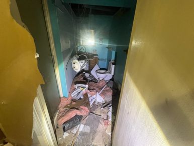 This bathroom was destroyed by squatters so they could get the copper plumbing out of the walls.