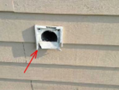Exterior dryer vent with damaged louver doors found during a home watch inspection.