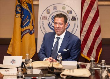 Man presenting ideas during a live event on stage