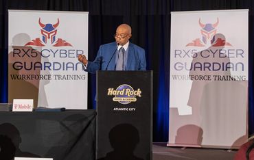 Speaker standing on stage delivering a talk