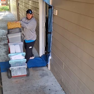 Mover moving totes on dolly