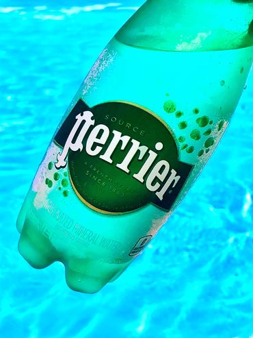 Bottle of Perrier by the pool