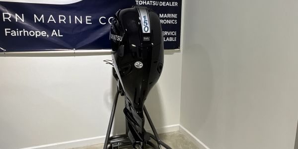 Black Tohatsu 150 outboard motor on a stand.