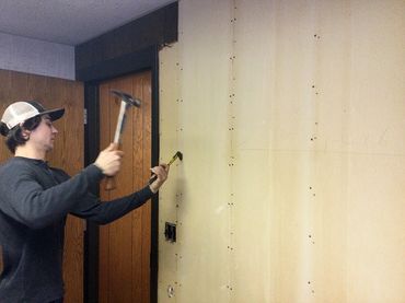 The framing materials behind this sheet rock are all able to be reclaimed following deconstruction.