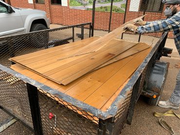 Reclaimed interior wall panels following deconstruction.