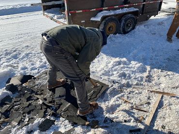 Removing asphalt shingles for recycling during deconstruction of a residential property