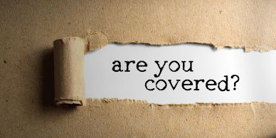 Torn paper revealing 'are you covered?' text.