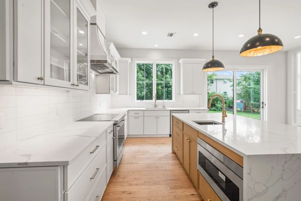 White Cabinets with Wood Island