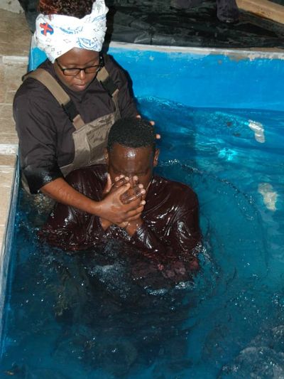 Fig. 1 shows Reverend Simangaliso Ncube baptising one of the candidates during the BICC Lobengula 20