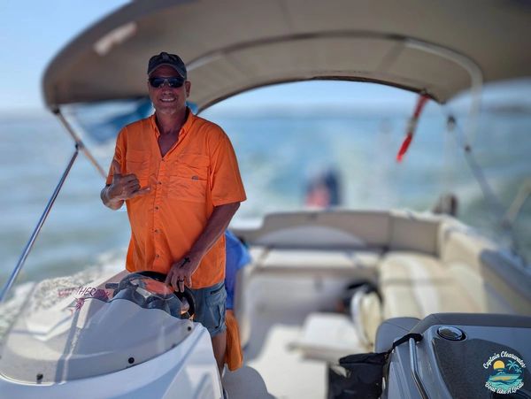 Captain Chris at the helm of Salt Therapy charter boat during a private cruise in Florida