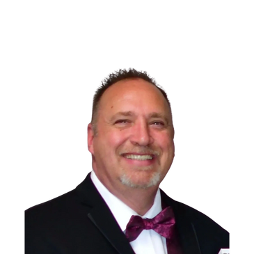 white man 50's in a black tux, smiling