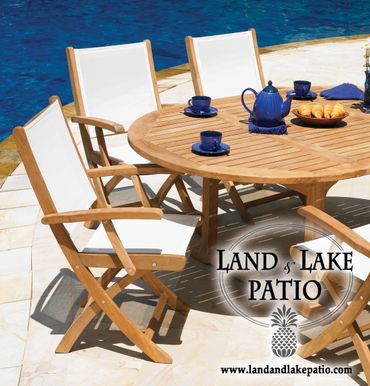 teak dining set with off white sunbrella slings on sunny patio