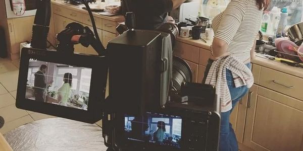 Couple filming in a kitchen