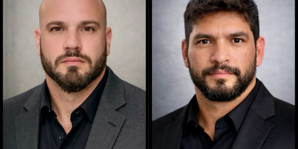 Two men in suits with beards.