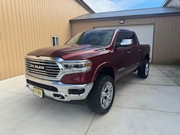 We are offering a 2020 Ram 1500 Crew Cab Laramie Longhorn finished in Burgundy with Brown leather in