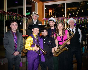 Matt Hill & The Classics on stage at a sold-out Mardi Gras show, bringing high-energy New Orleans f