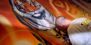 Work in progress of Timm Etters' airbrushed mural in the cafeteria at Wheaton Warrenville South HS.