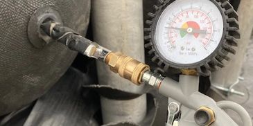 a photo with air gauge measuring air in the equipment