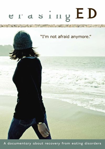 Cover of Erasing ED dvd. A woman walks by the ocean; her face is obscured, but the view is expansive