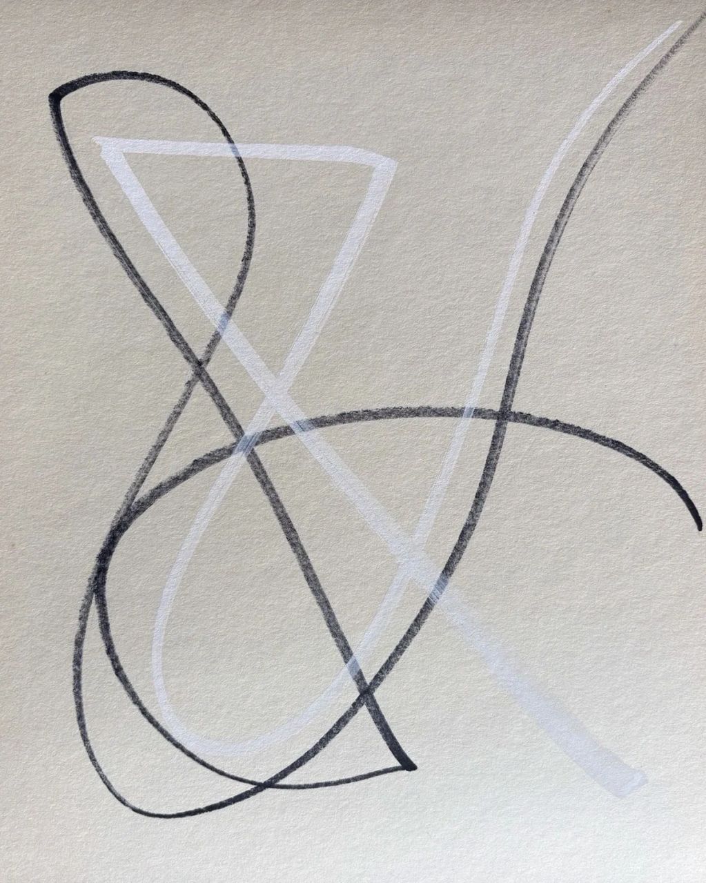 Abstract loops and curves in black and white on textured paper.