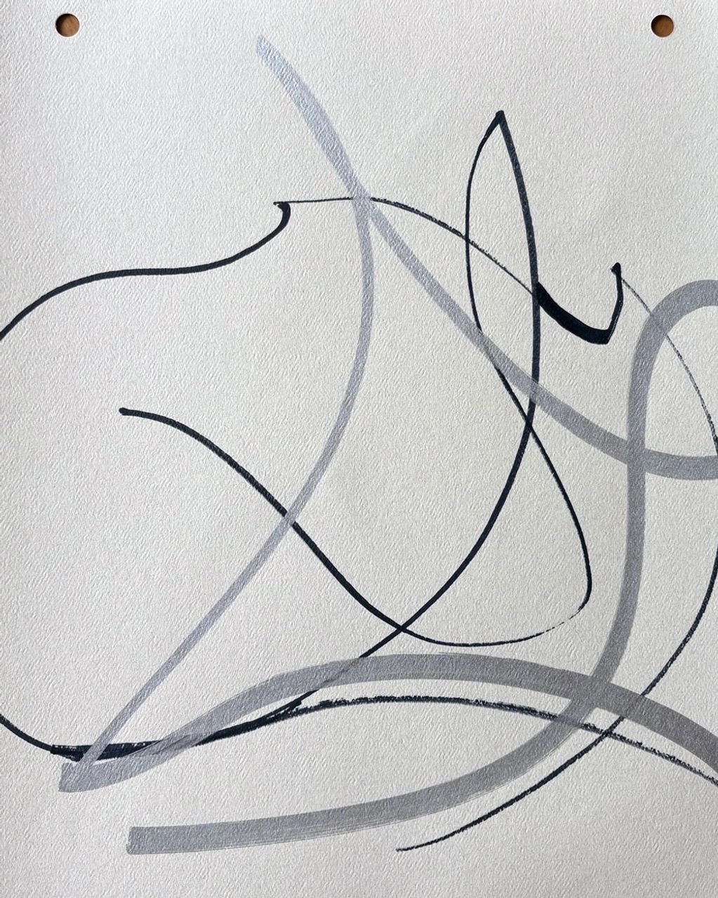 Abstract black and gray fluid lines on textured paper.