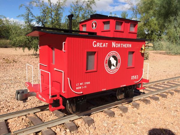 Red Great Northern caboose featuring Miracle Graphics lettering and decals