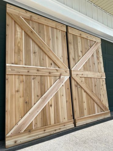Exterior barn doors made with rough pine.