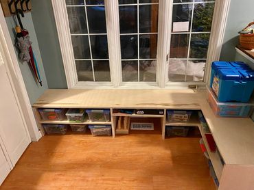 Custom made front entrance bench for toys and shoes.