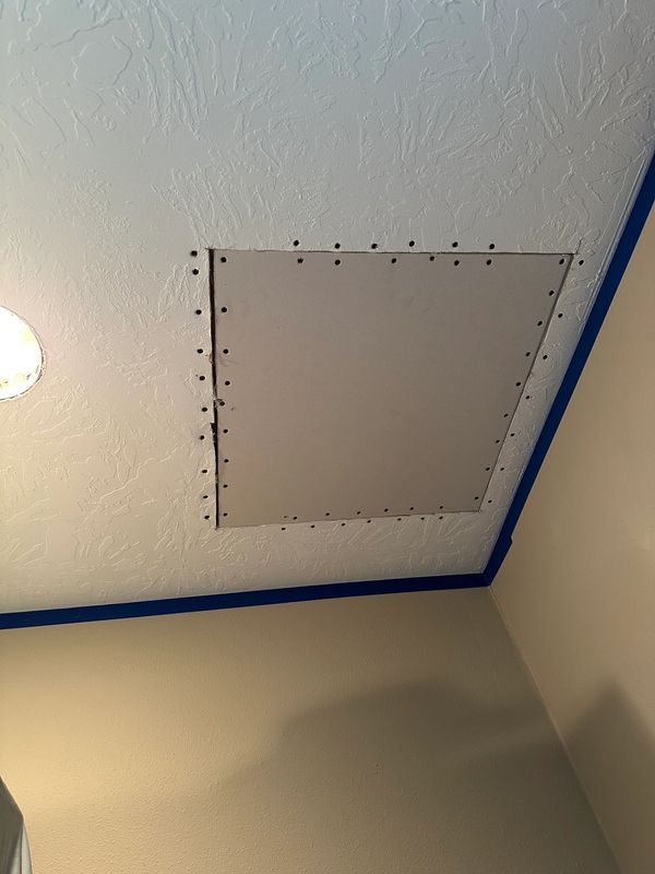 Ceiling patch after cut out and board installation.