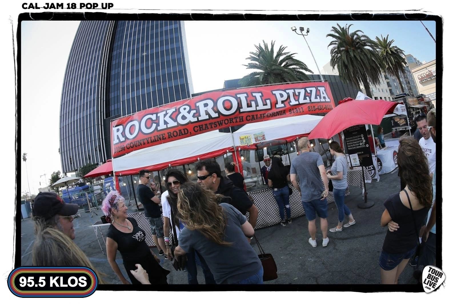 Photo of Rock & Roll Pizza catering event showing people in front of our mobile pizza kitchen.