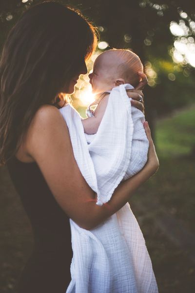 mother holding baby