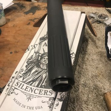 Suppressor alignment is checked and a high temperature Cerakote finish is applied to finish the moun