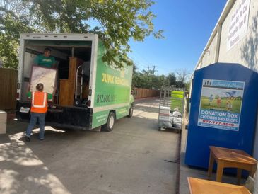 Green Source Junk Removal team donating furniture in Fort Worth